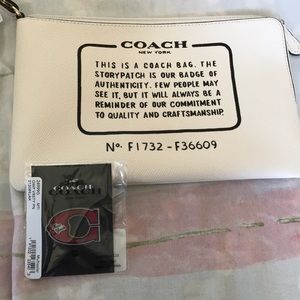 Coach pochette and pin